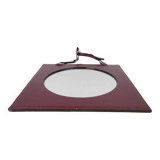 Mirror covered in burgundy leather