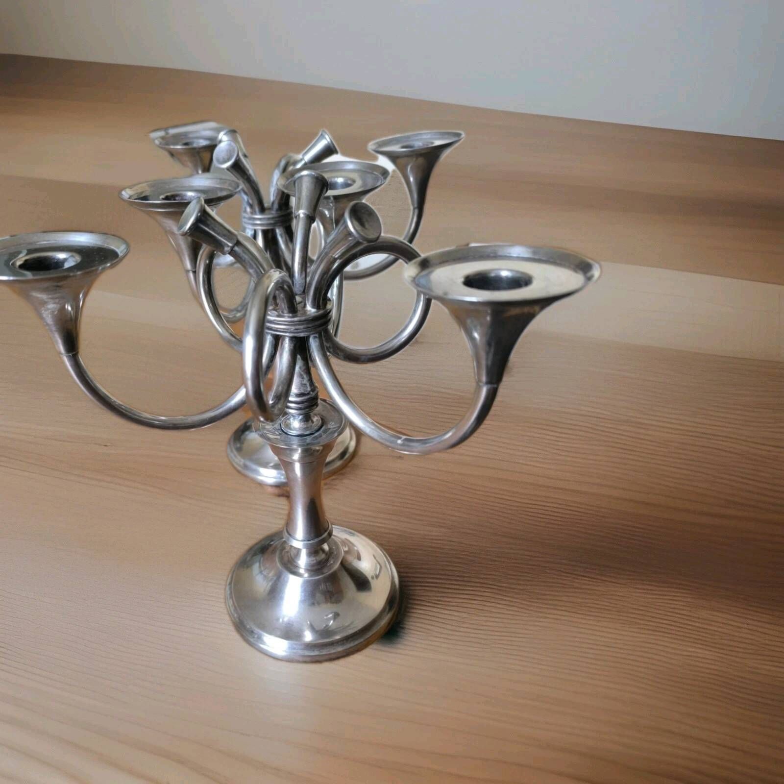 Ercuis pair of candlesticks model Cheverny in silver-plated metal with hunting horn decoration.