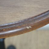 oak tray table with cast iron legs and pair of bistro chairs