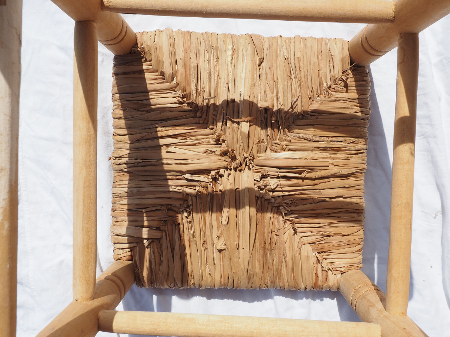 Farm stool made of wood and straw