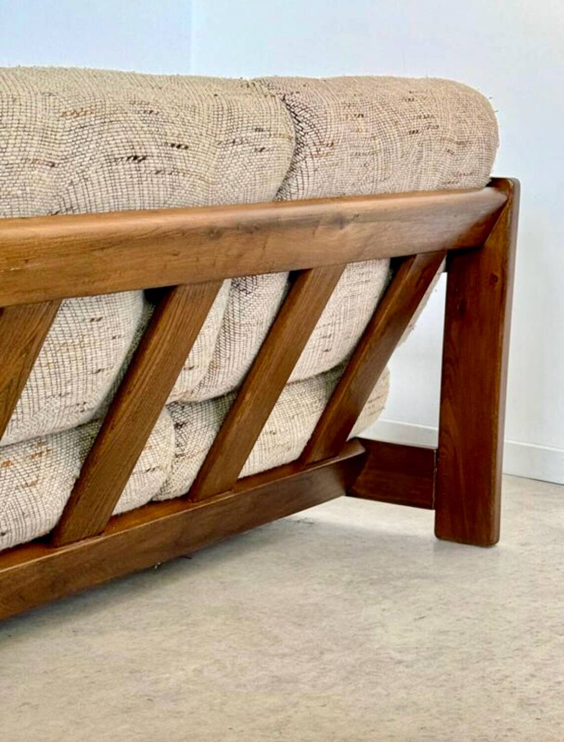 Old 3-seater sofa in solid wood, Maison Regain design, from the 70s.