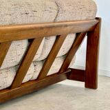 Old 3-seater sofa in solid wood, Maison Regain design, from the 70s.