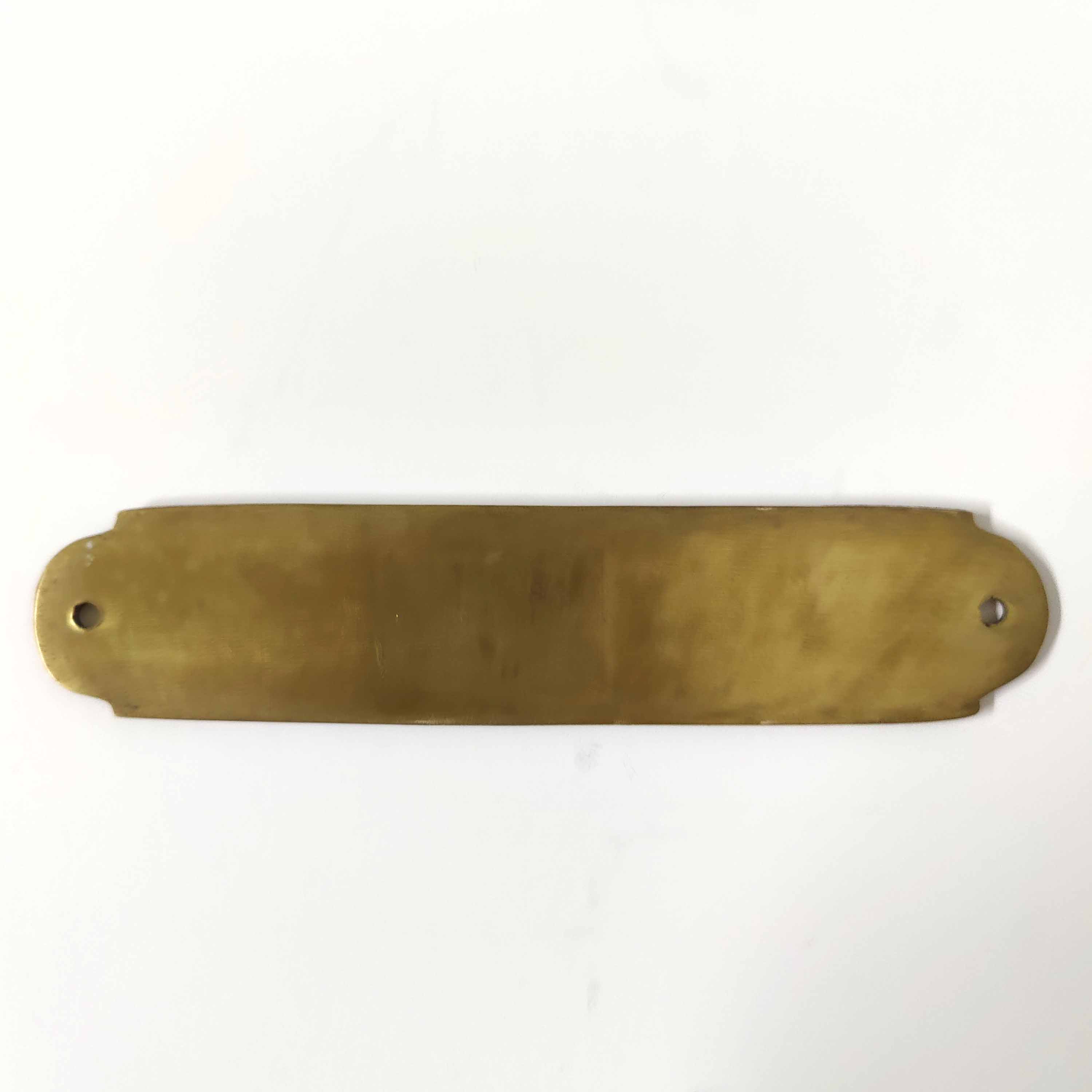 Brass bathroom door plate
