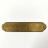 Brass bathroom door plate