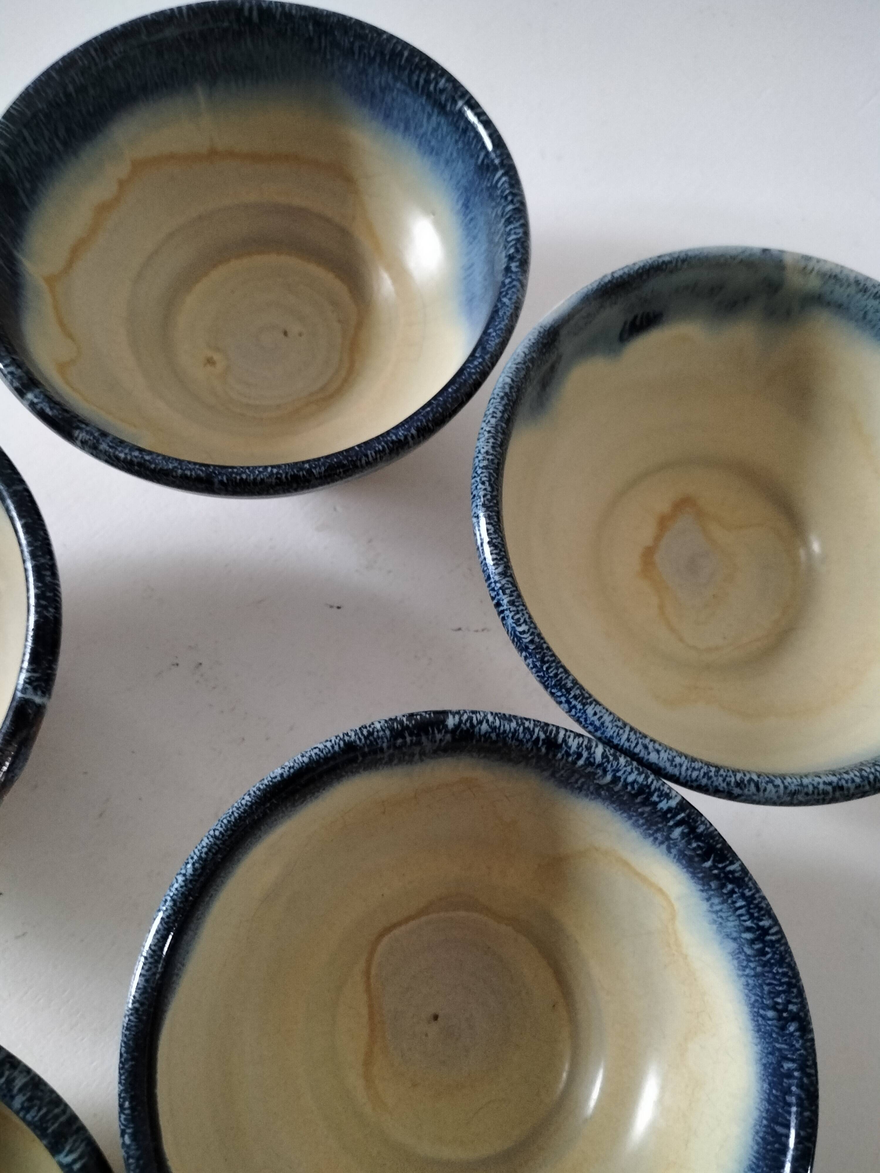 Set of 5 small blue and cream glazed stoneware bowls