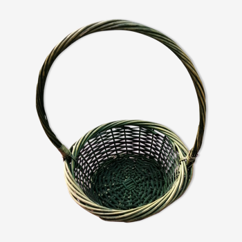 Green wicker basket with a large vintage handle