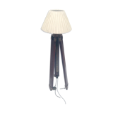 Classic lampshade on antique surveyor tripod