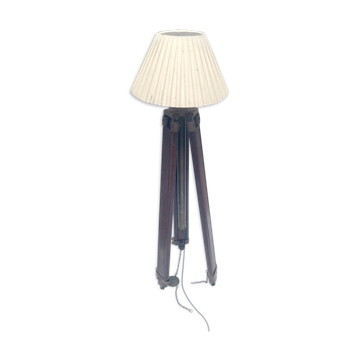 Classic lampshade on antique surveyor tripod