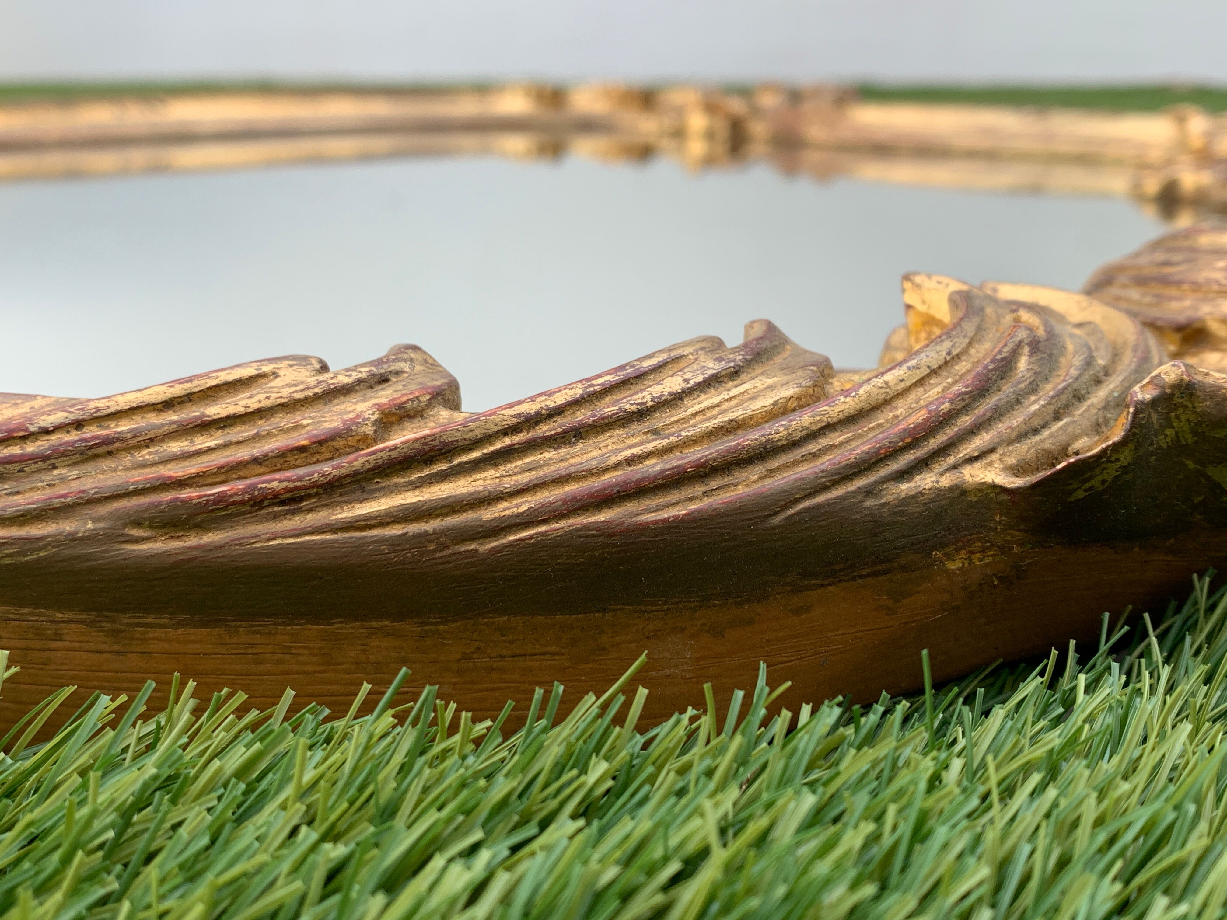 Old mirror in carved wood and gilded leaf, Louis XV rocaille style, twentieth century 59x87cm