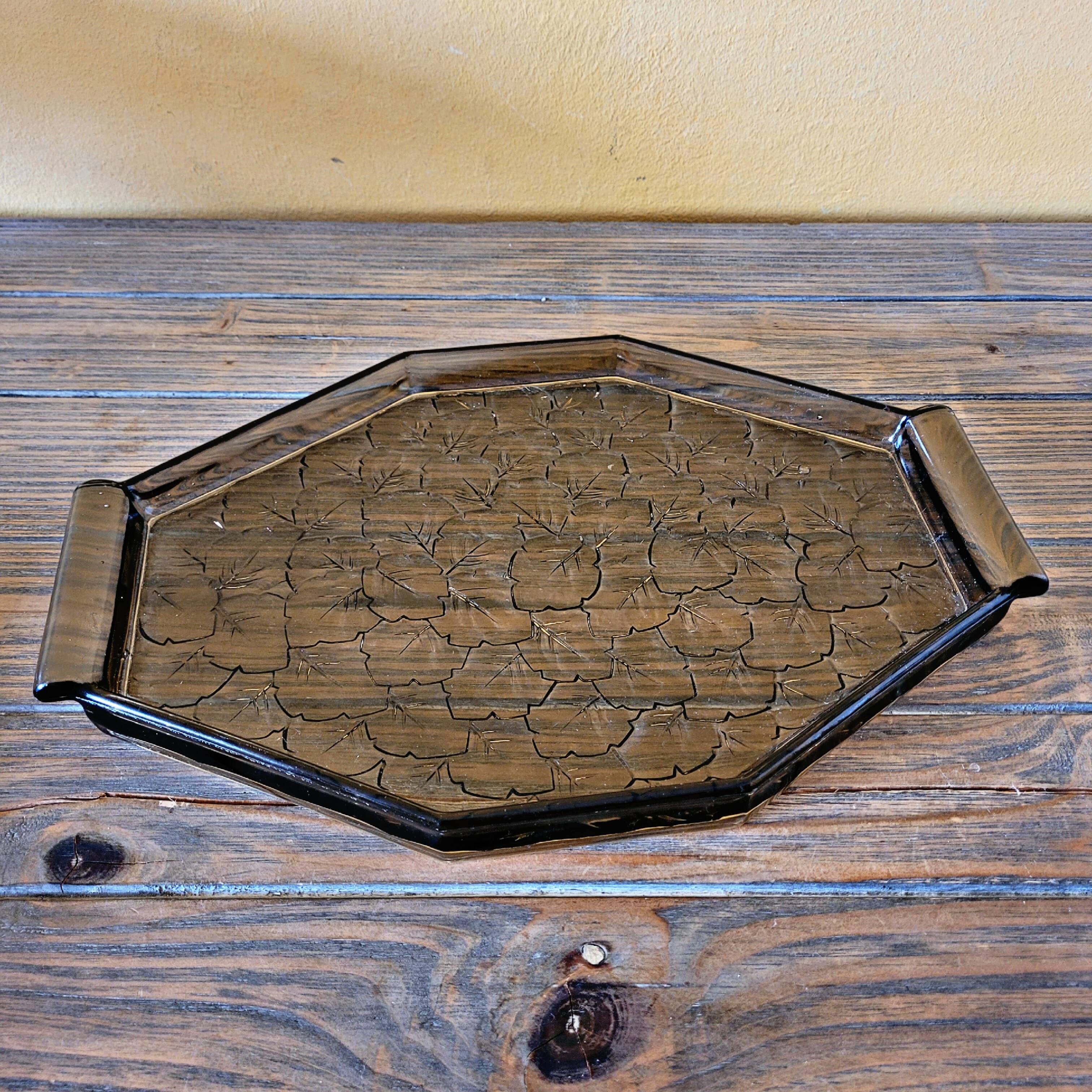 Art deco style black glass tray decorated with leaves