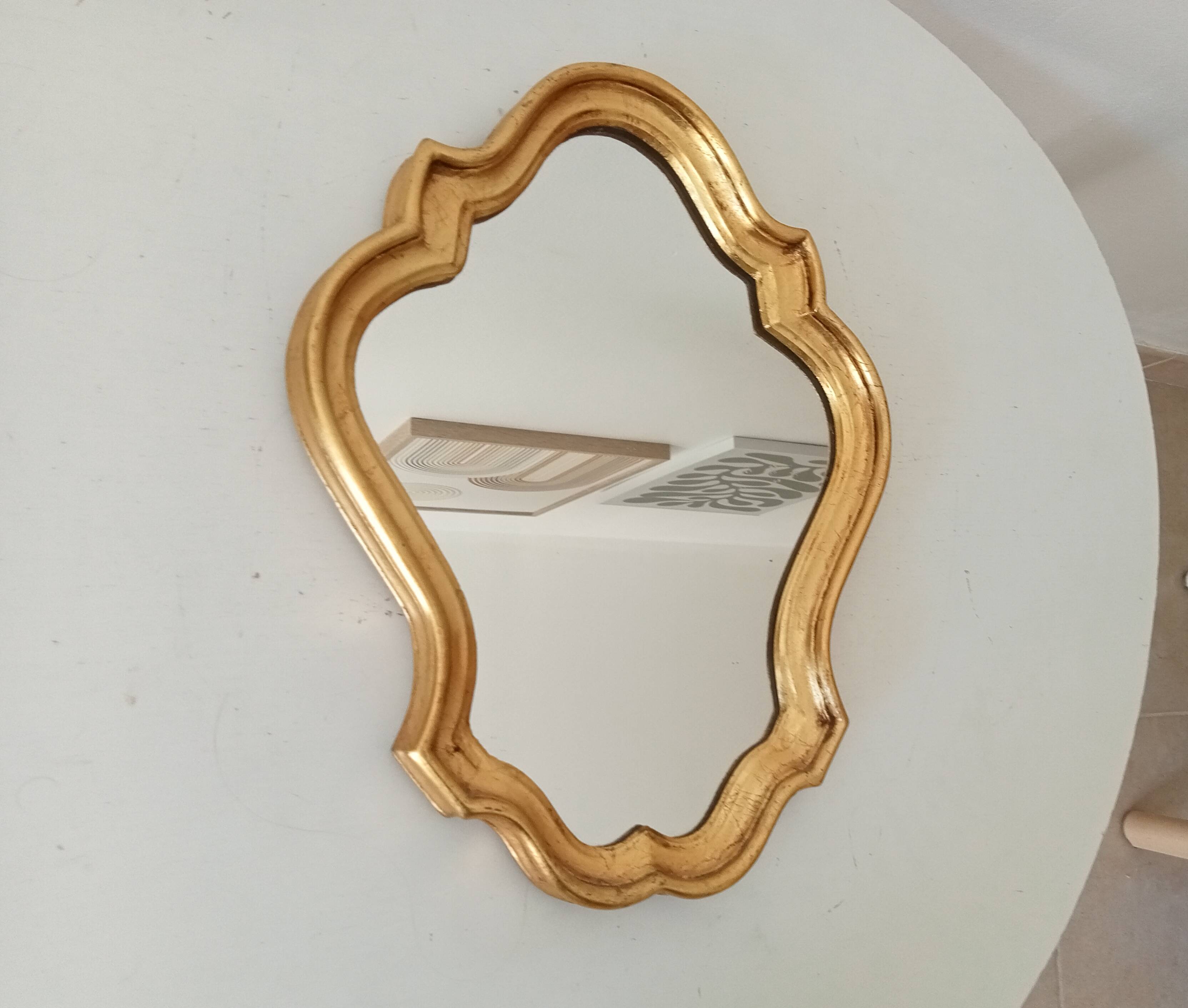 Baroque mirror in gilded wood from the 1960s.