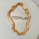 Baroque mirror in gilded wood from the 1960s.