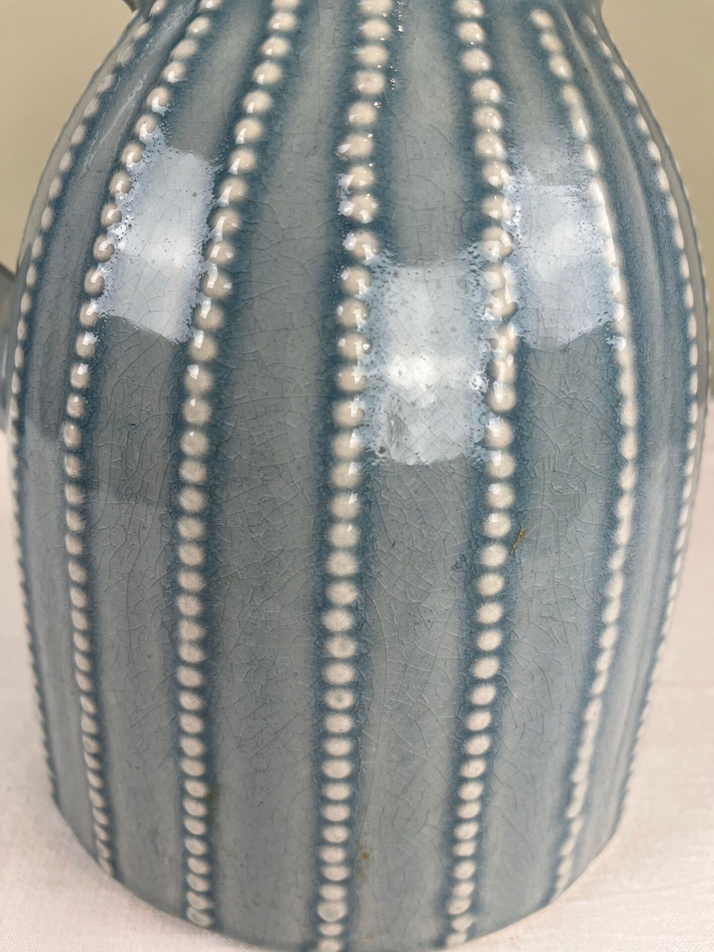 Large vintage pitcher in crackled celadon ceramic, beaded decoration.