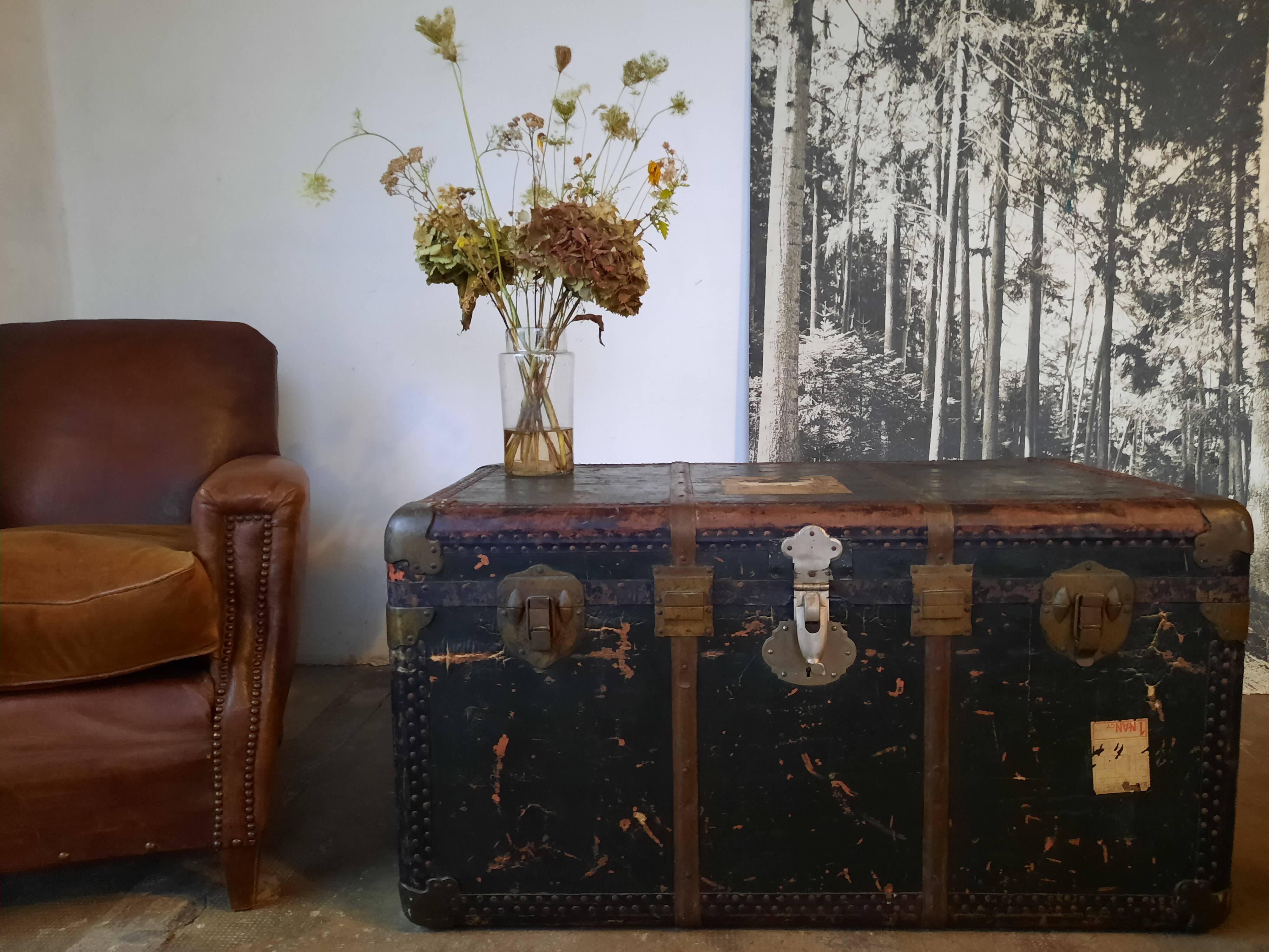 Old and large travel trunk, brass-plated corners