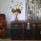 Old and large travel trunk, brass-plated corners