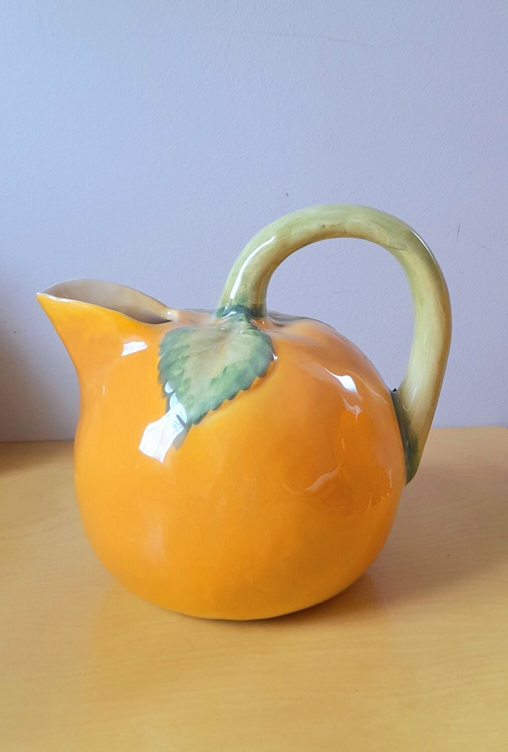 Orange pitcher in slip