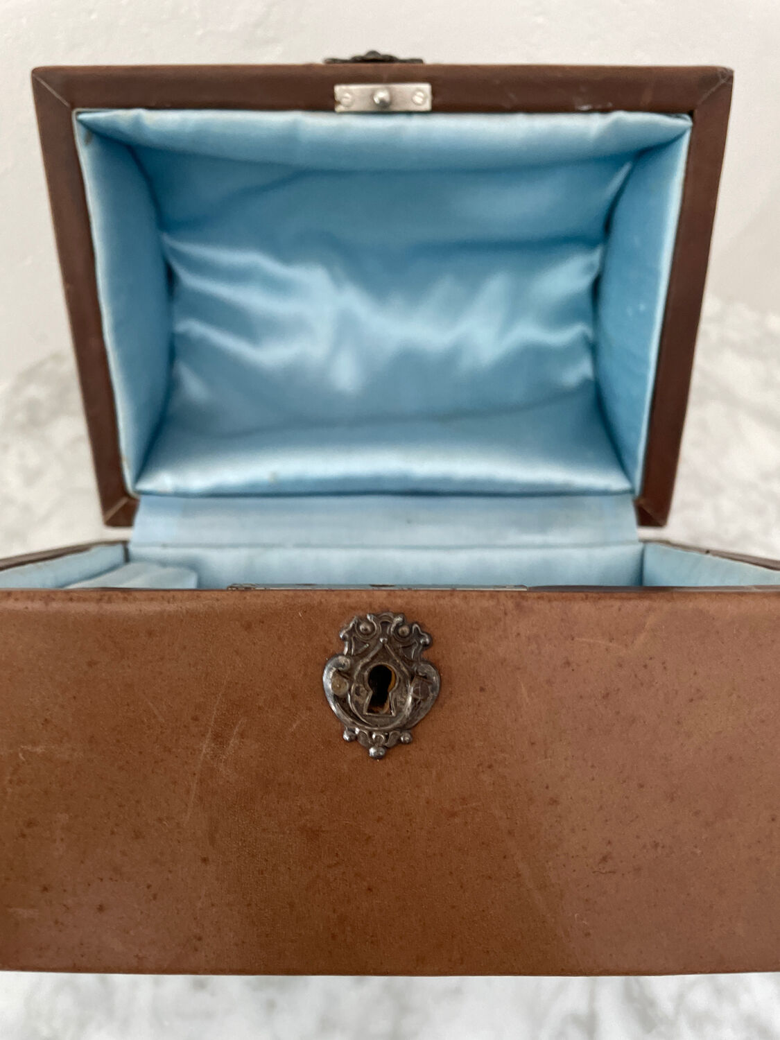 Vintage leather and silver metal jewelry box.