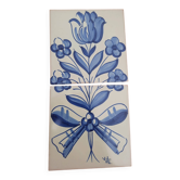 Hand-painted ceramic tiles with a blue flower pattern.