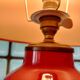Vintage ceramic table lamp with a lacquered finish, golden potiche base and brass.