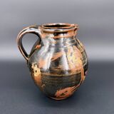 Signed black and red glazed stoneware pitcher, French artisanal ceramics