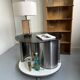 Vintage metal and smoked glass coffee table on casters bar