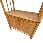 Bamboo and wicker bookshelf, vintage boho-chic from the '70s.