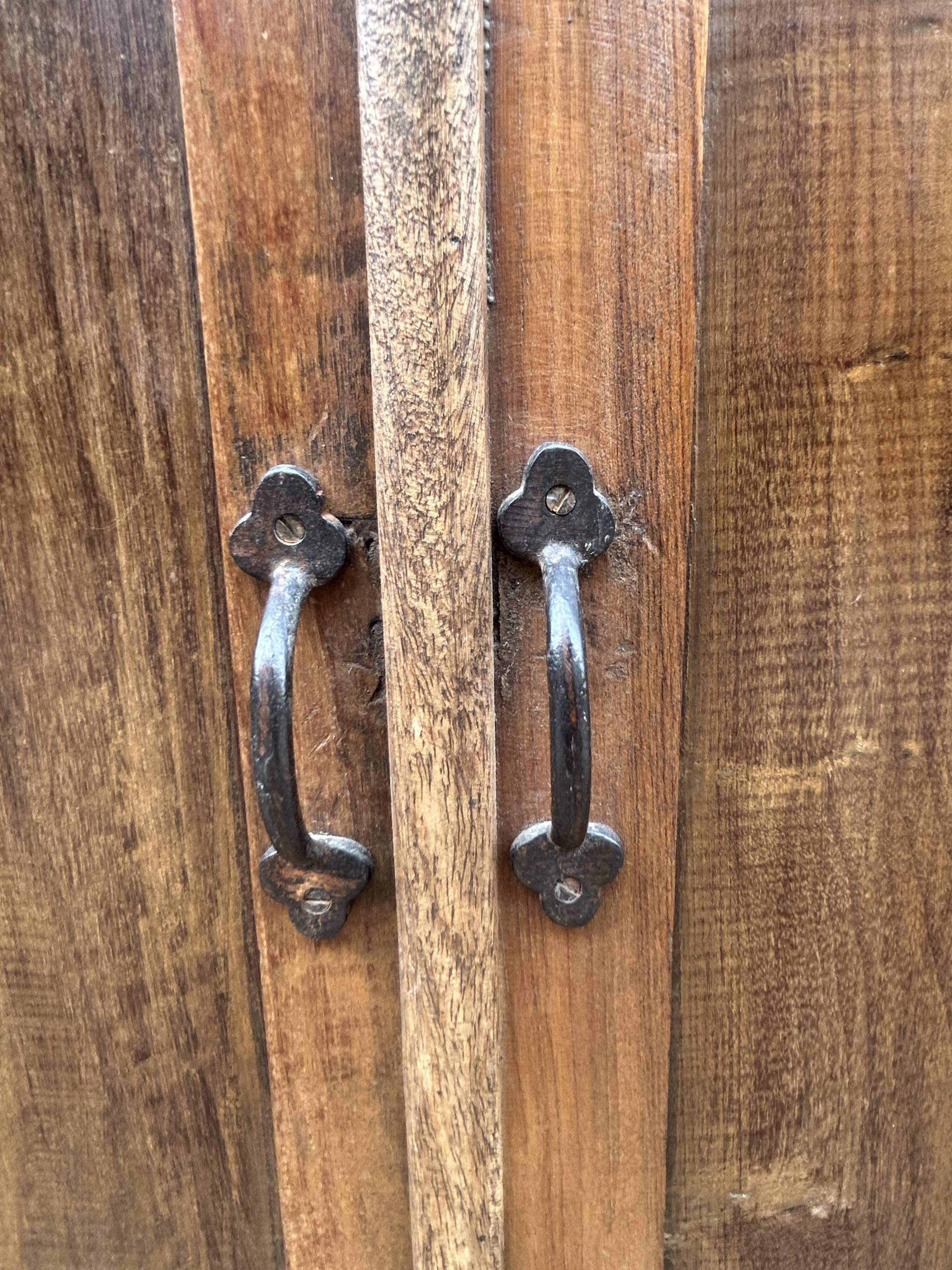 Art Deco glass-fronted cabinet in Burmese teak with original patina.