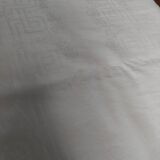 Table napkins set of eleven in a single piece damask linen and silk early 20th century.