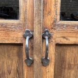 Art Deco glass-fronted cabinet in Burmese teak with original patina.