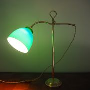 Desk lamp in brass with a swan neck and green opaline glass.