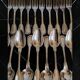 24 silver-plated metal table settings in the filet model.