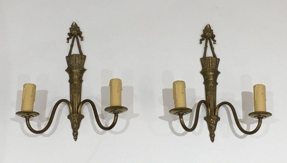 Pair of Louis XVI style bronze wall sconces with quivers and ribbons