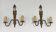 Pair of Louis XVI style bronze wall sconces with quivers and ribbons