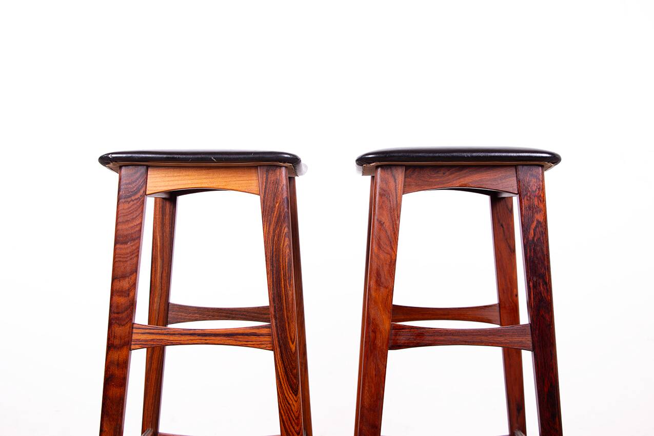 4 Danish high stools, rosewood and black leather, Knud Bent for Dyrlund.