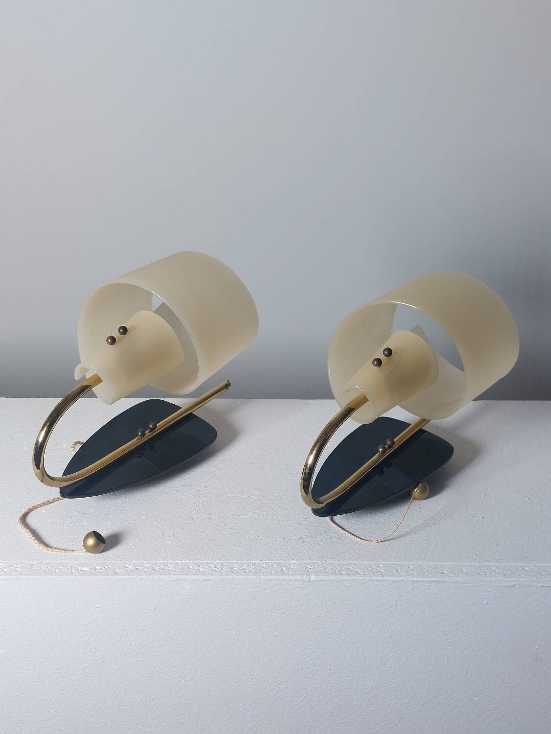 Pair of vintage wall lamps from the 1950s in brass.