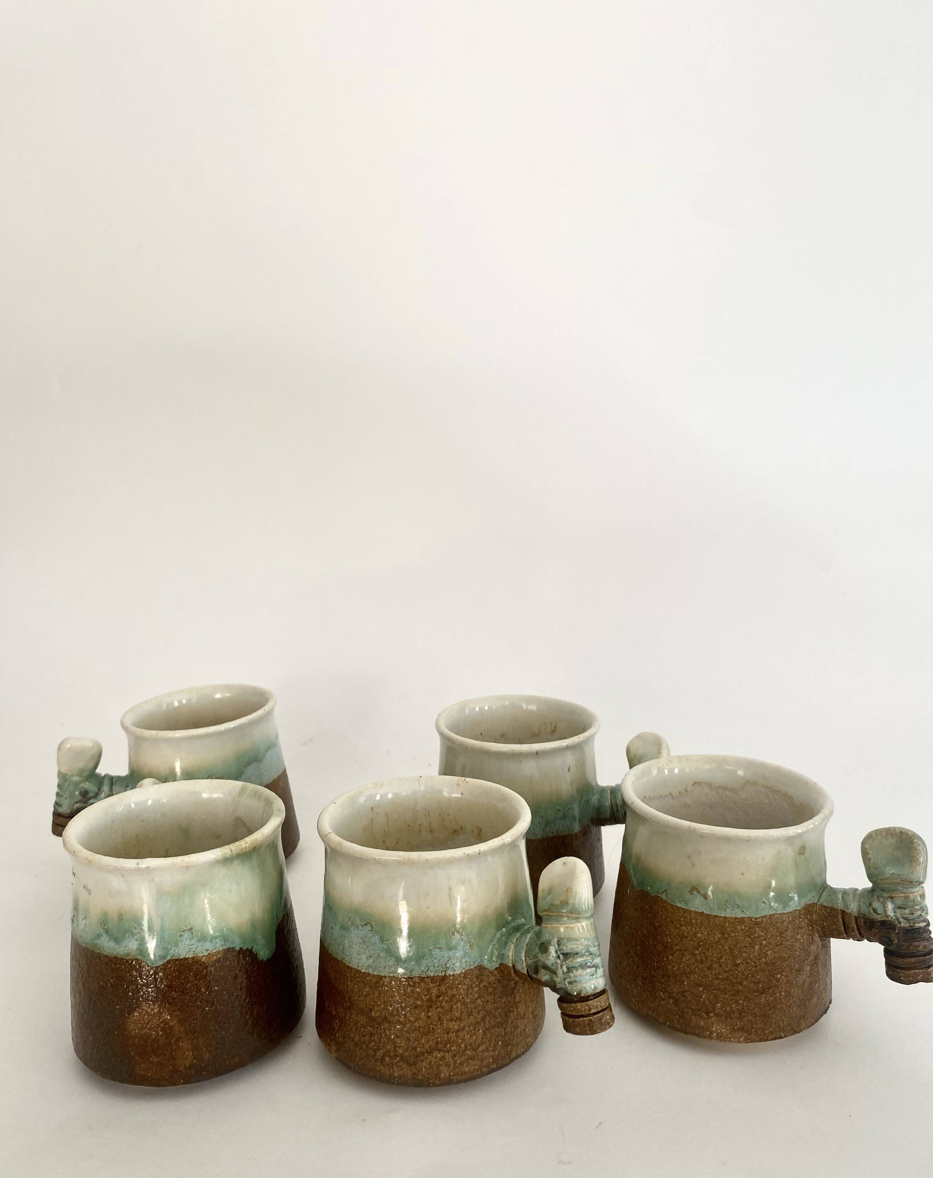 5 glazed and scarified ceramic cups