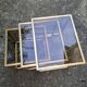 Vintage 1980s gold metal and smoked glass nesting tables