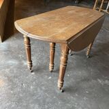 Old wooden table with folding flaps