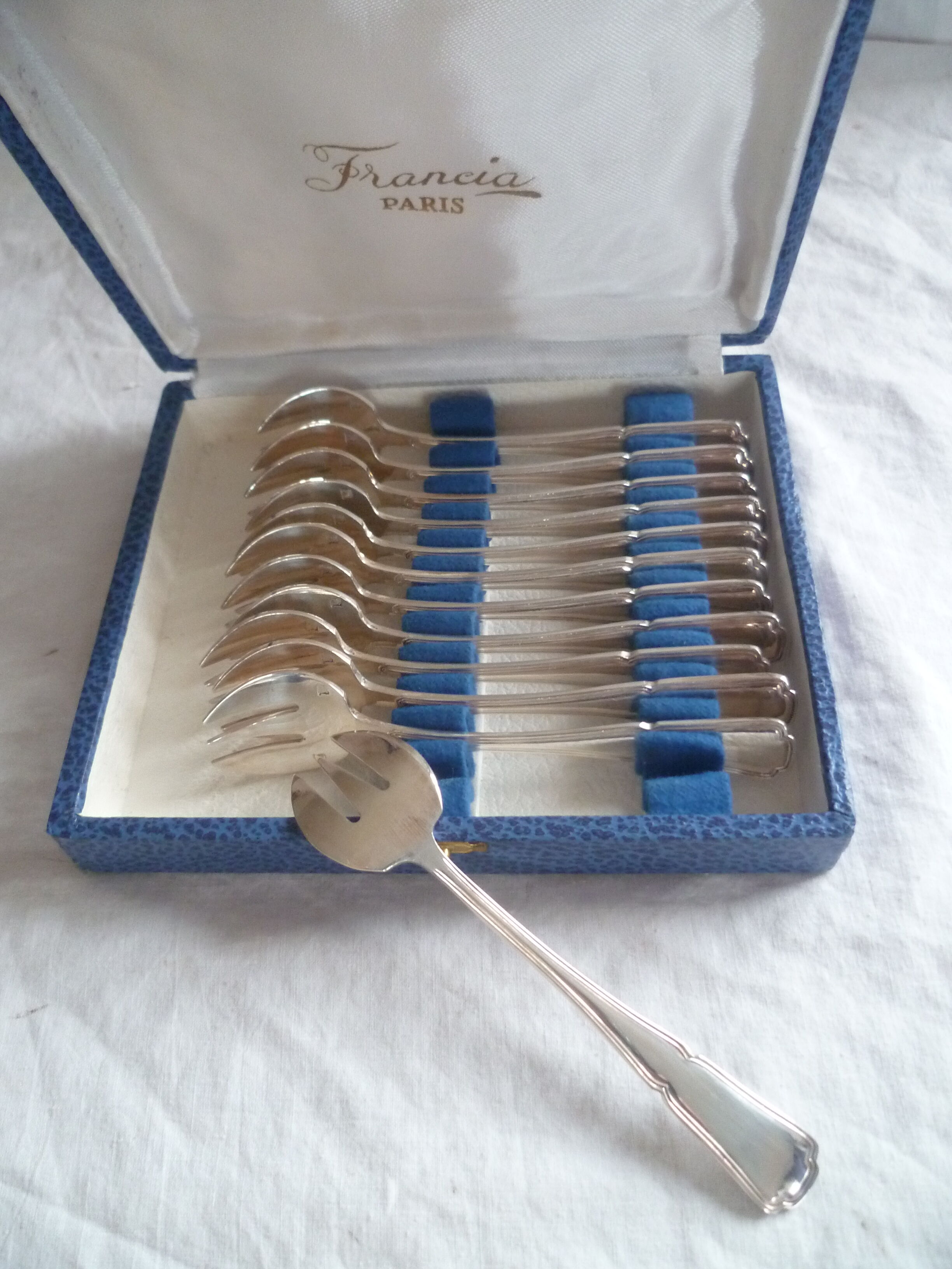 12 fourchettes a huitres en met. argente