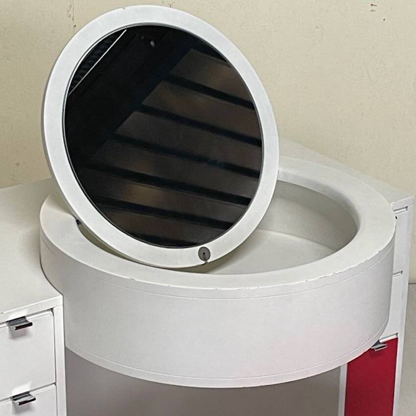 Bathroom toilet with a 70s pouf.