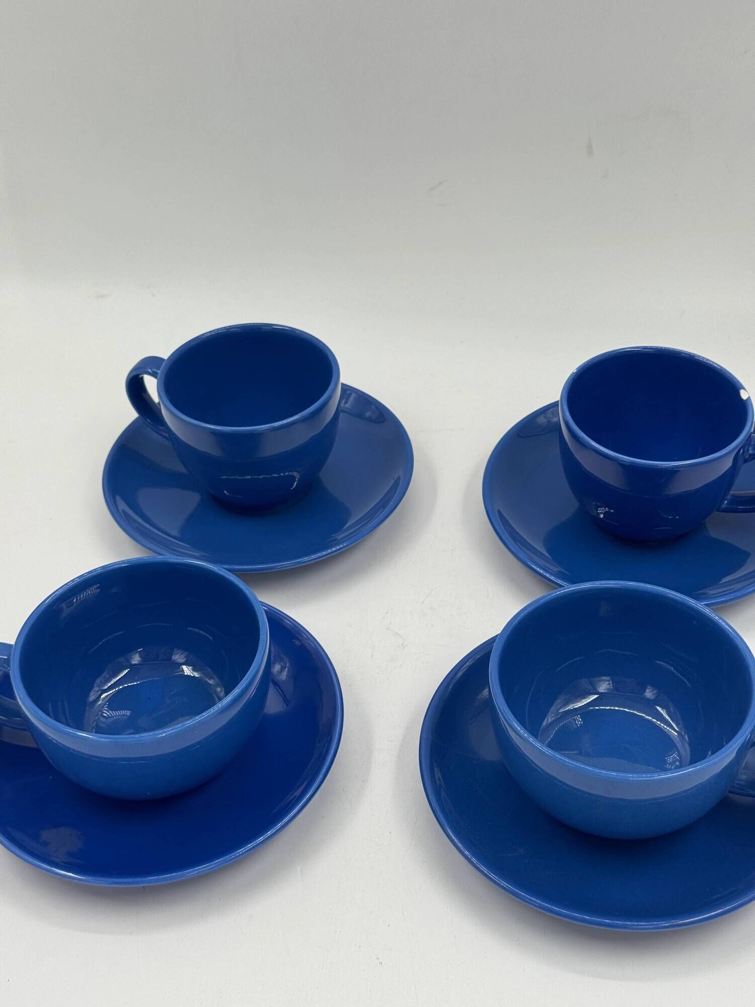 Set of 4 vintage blue ceramic cups and saucers.