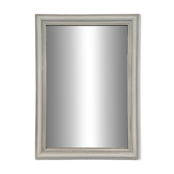 Large rectangular mirror with a white lacquered wooden frame.