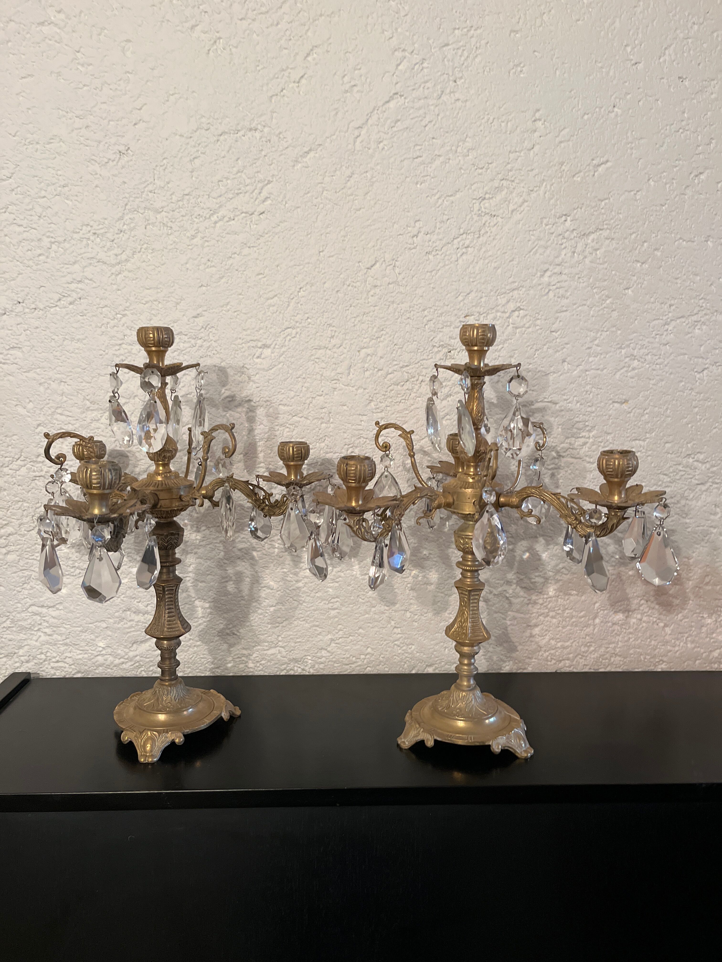 Duo of bronze chandeliers with tassels