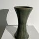 Dark green handcrafted vase with glazed ceramic grass blades