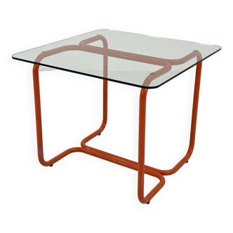 Orange tubular dining table in metal and glass, 1980s