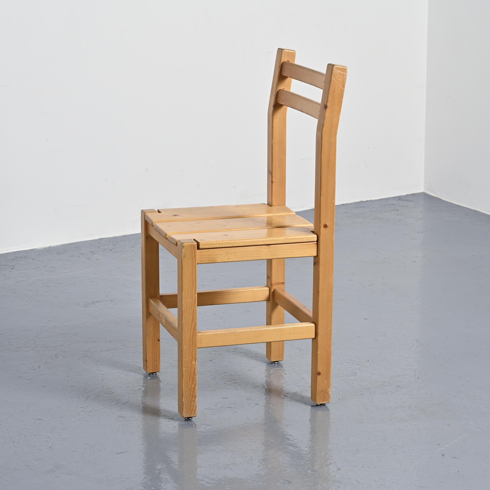Set of four solid pine chairs by Maison Regain.