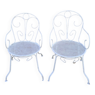 Pair of old white iron armchairs