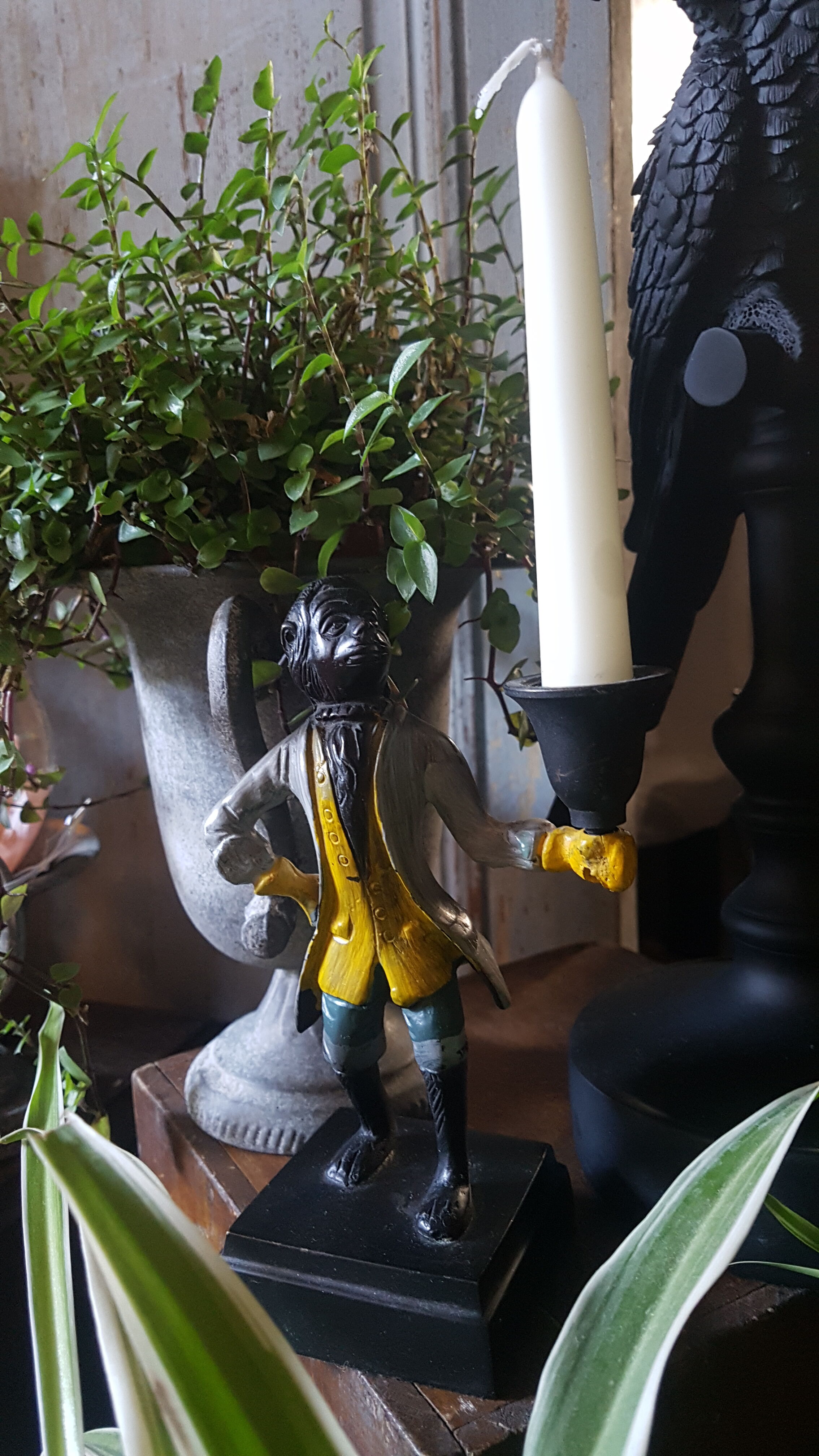 Cast iron servant monkey candle holder