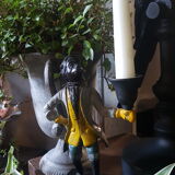 Cast iron servant monkey candle holder