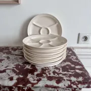 The earthenware fondue plates from Haute-Provence.